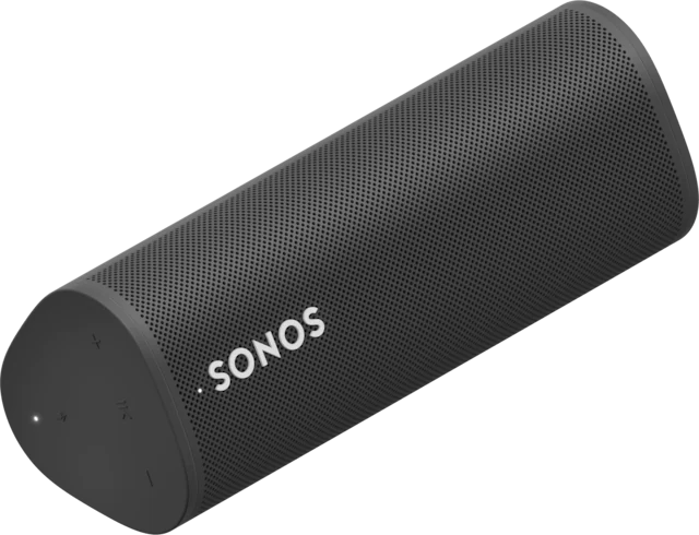 a black sonos speaker is sitting on a white surface .