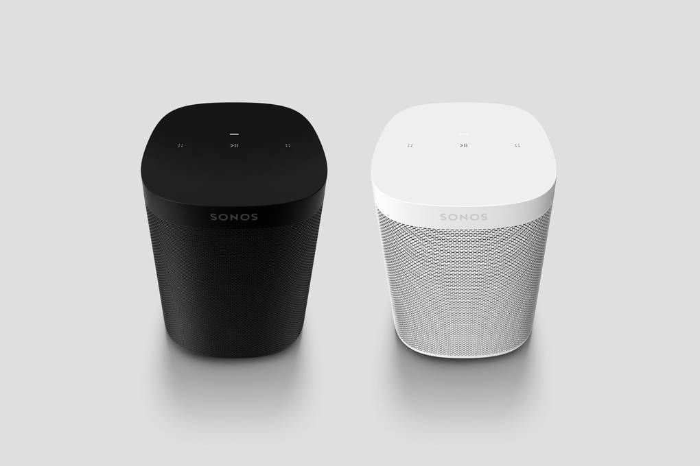 A black and white sonos speaker sitting next to each other