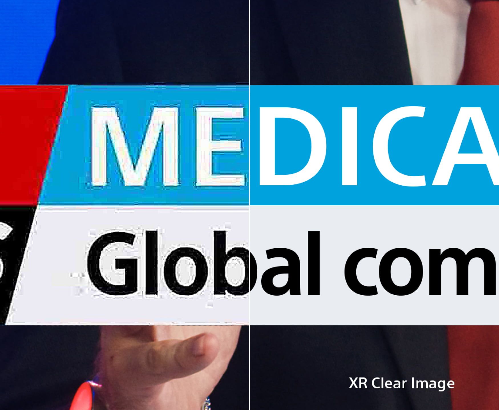 a person holding a sign that shows the clarity of the sony oled 4k tvs