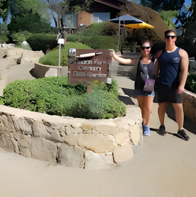 Garden pathway surrounded by sculptures and native plants at Alta Vista Botanical Gardens.