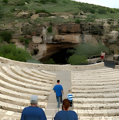 Vast underground limestone cave formations with stalactites and illuminated pathways in Carlsbad Caverns National Park.