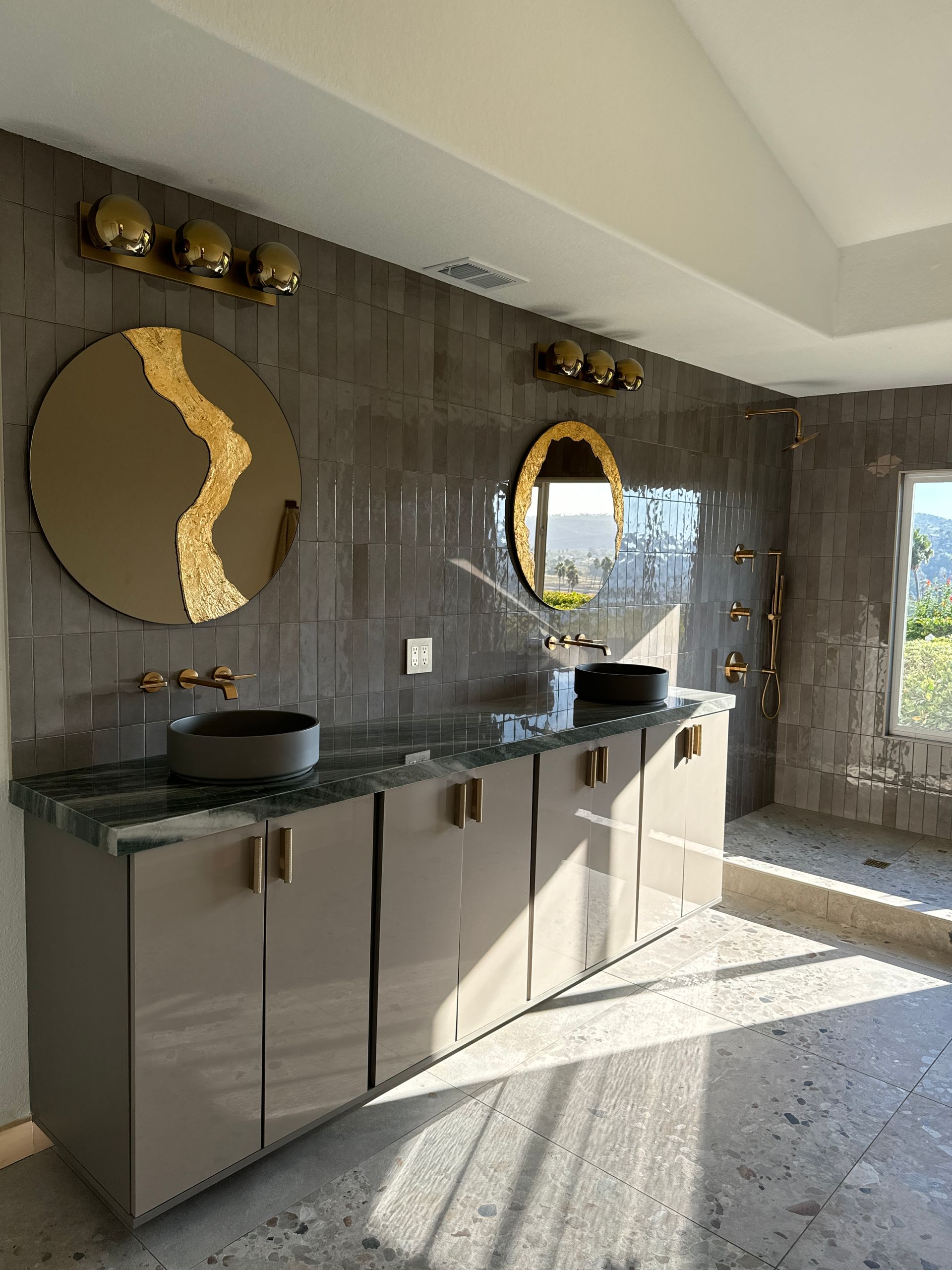 Bathroom renovation featuring walk-in shower and double vanity