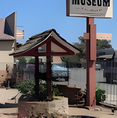 Historic building exterior showcasing cultural exhibits and informative displays at Guy B Woodward Museum