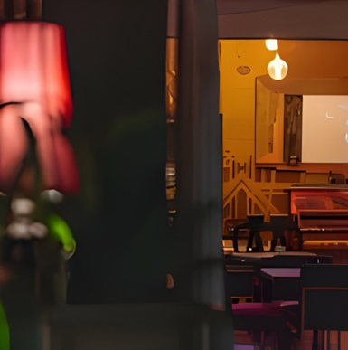 Exterior view of Harlow’s Restaurant with outdoor patio and evening lighting