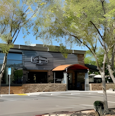 Exterior of Karl Strauss Brewing Company with outdoor seating and brewery signage