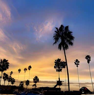 Sandy beach with gentle waves and families enjoying the sun at La Jolla Shores Park