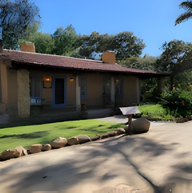 Historic ranch buildings and courtyards surrounded by native landscaping at Leo Carrillo Ranch Historic Park.