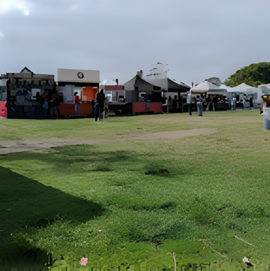 Shoppers browsing fresh produce and local goods at the Leucadia Farmers Market.