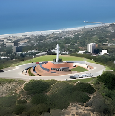 An aerial view of the Mount Soledad National Veterans Memorial in La Jolla, California, featuring a large white cross.