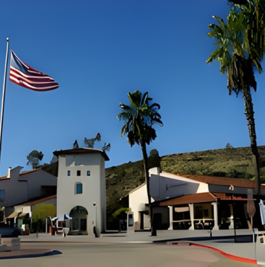 Shoppers walking along storefronts and landscaped pathways at River Village Plaza