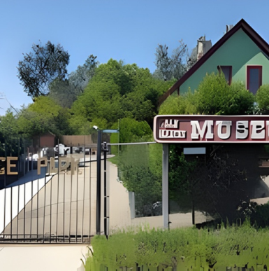 Historic building exterior with informative exhibits and charming architecture at San Marcos Historical Society