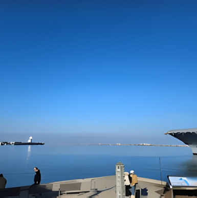 Historic aircraft carrier museum docked in San Diego harbor with visitor exhibits