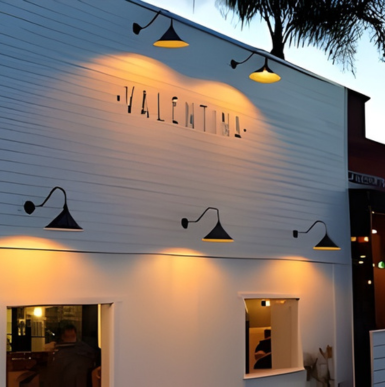 Outdoor patio dining area at Valentina restaurant in Leucadia with Spanish-inspired decor.