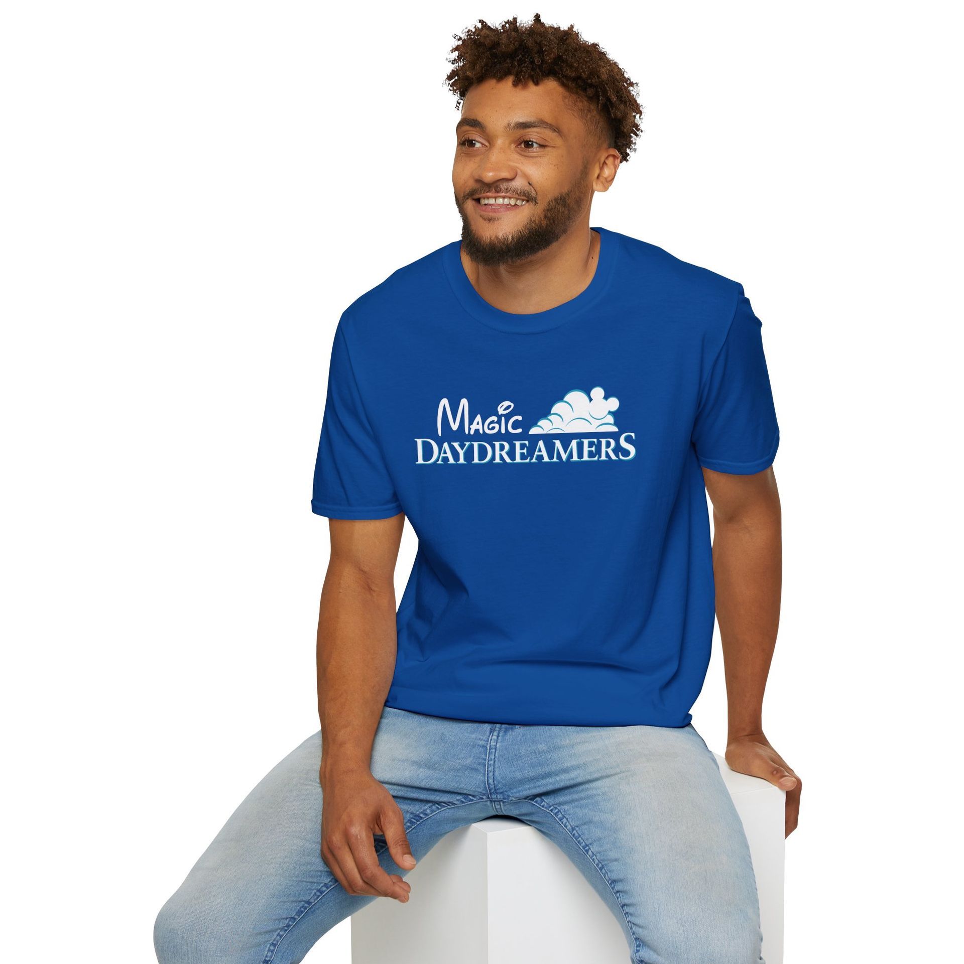 A man wearing a blue shirt that says magic daydreamers shirt merch