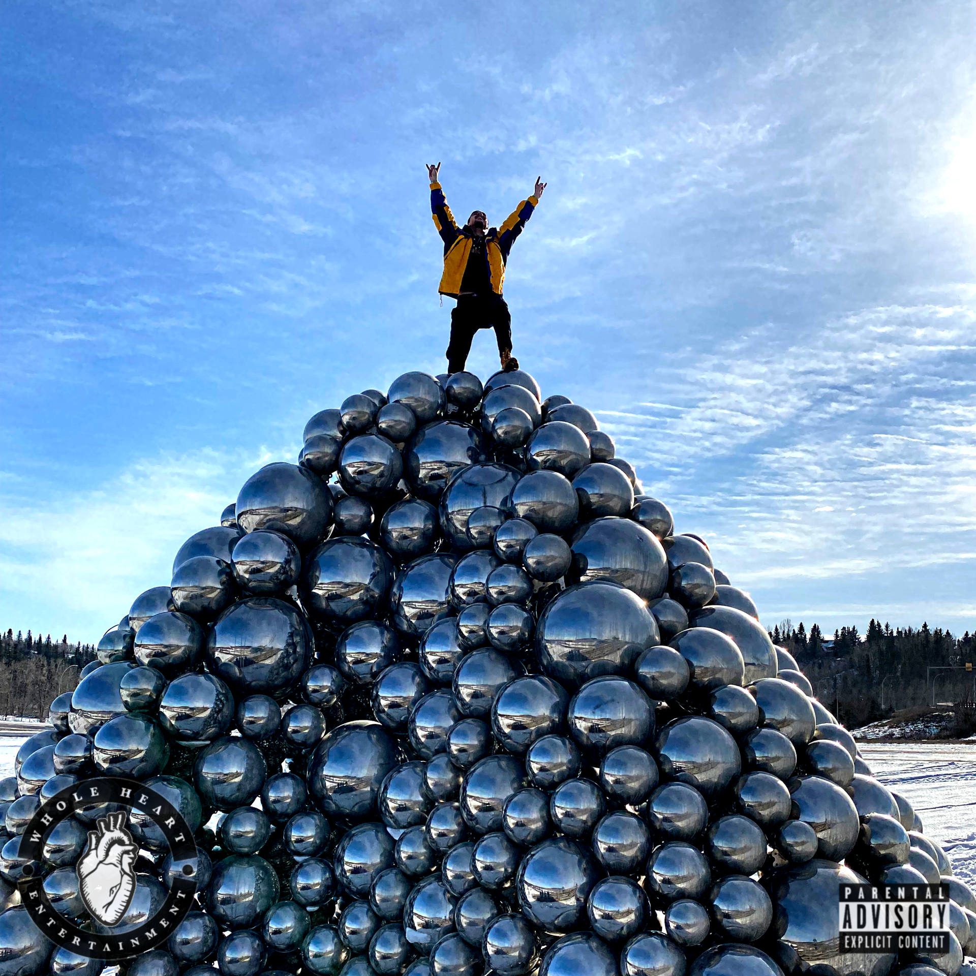 Pictured: ILLiam in a yellow jacket triumphantly standing atop the Talus Dome balls in Edmonton, Alberta