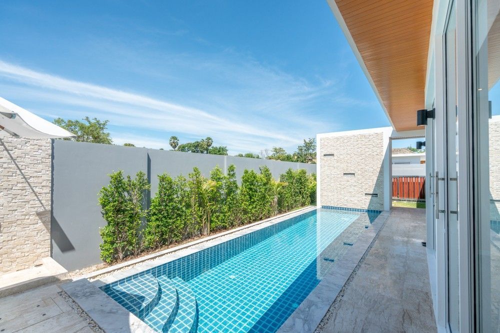 Long, Narrow Swimming Pool with Clear Blue Water — Coastcrete Concrete Specialist in Raymond Terrace, NSW
