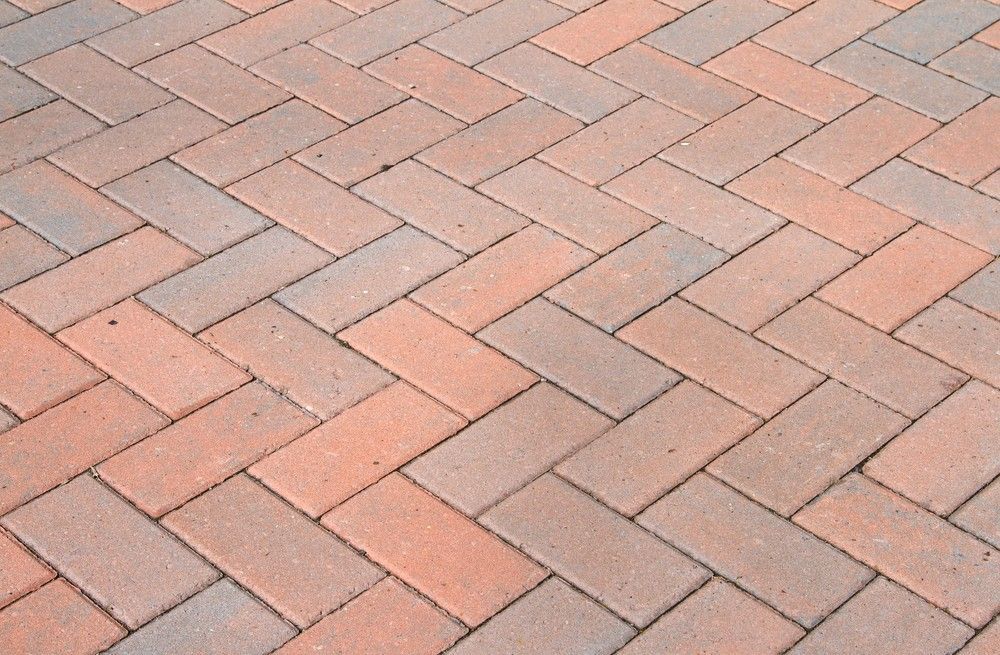 Herringbone Pattern Brick Pavement; Red and Brown Bricks — Coastcrete Concrete Specialist in Tea Gardens, NSW