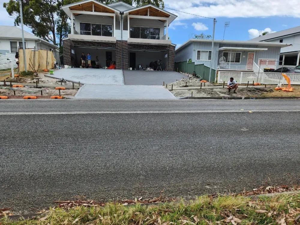 Gravel Driveway Leading to A House with A Garage — Coastcrete Concrete Specialist in Taylors Beach, NSW