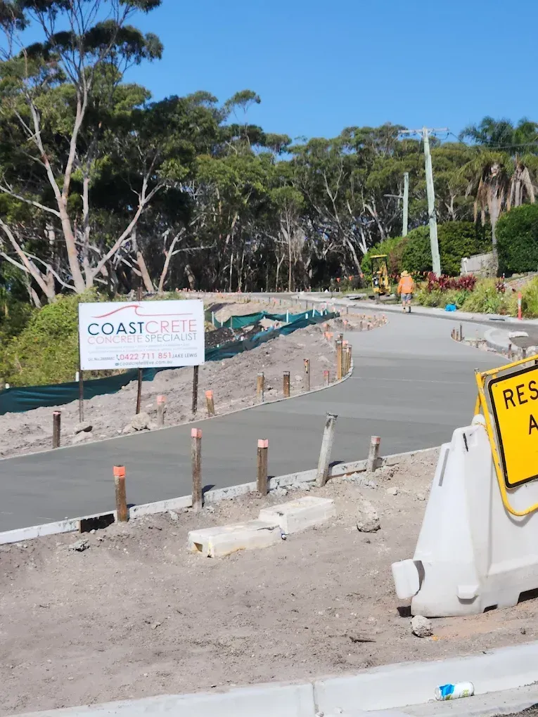 Freshly poured concrete pathway on a sloped street — Coastcrete Concrete Specialist in Taylors Beach, NSW — Coastcrete Concrete Specialist in Taylors Beach, NSW