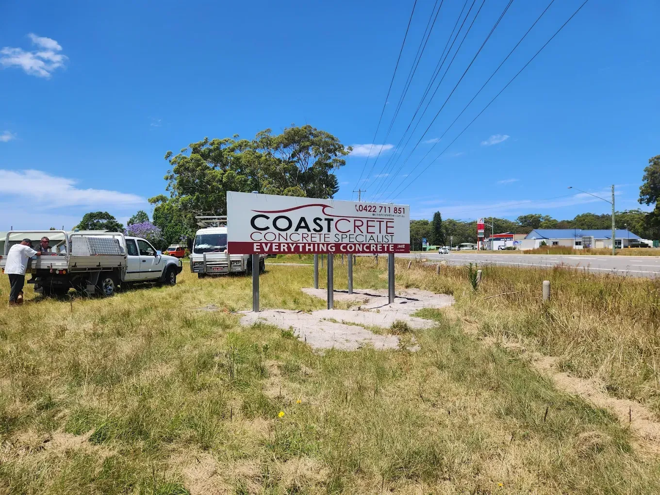 Freshly Poured Concrete Being Smoothed in A Scrap Metal Yard — Coastcrete Concrete Specialist in Taylors Beach, NSW