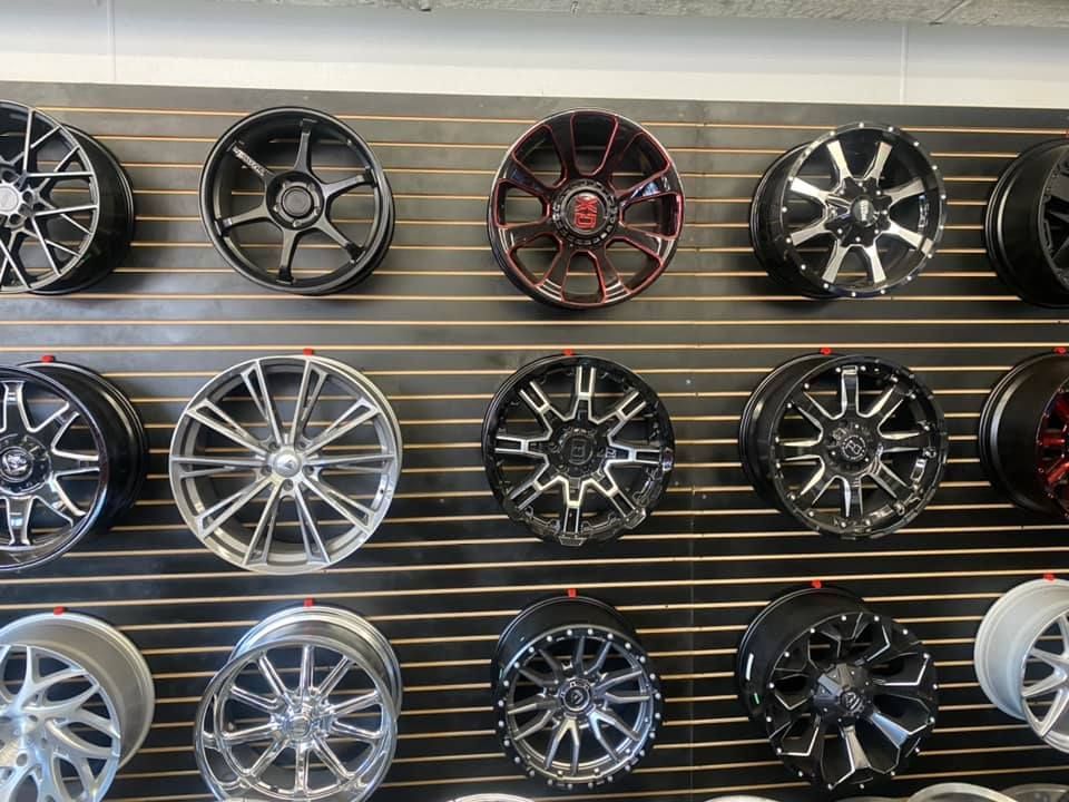 A wall filled with lots of different types of wheels.