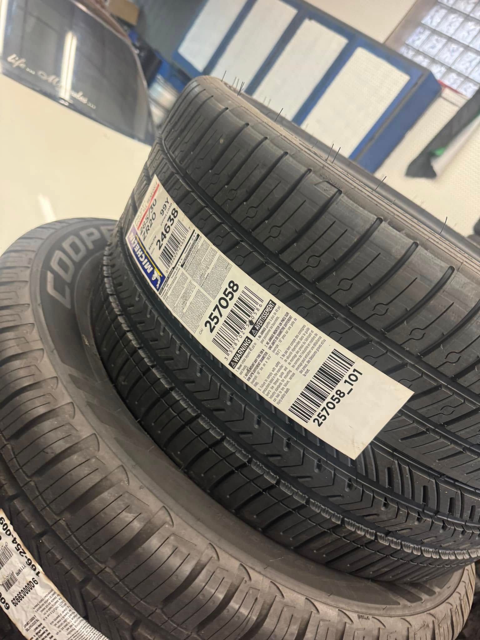 Two tires are stacked on top of each other on a table.