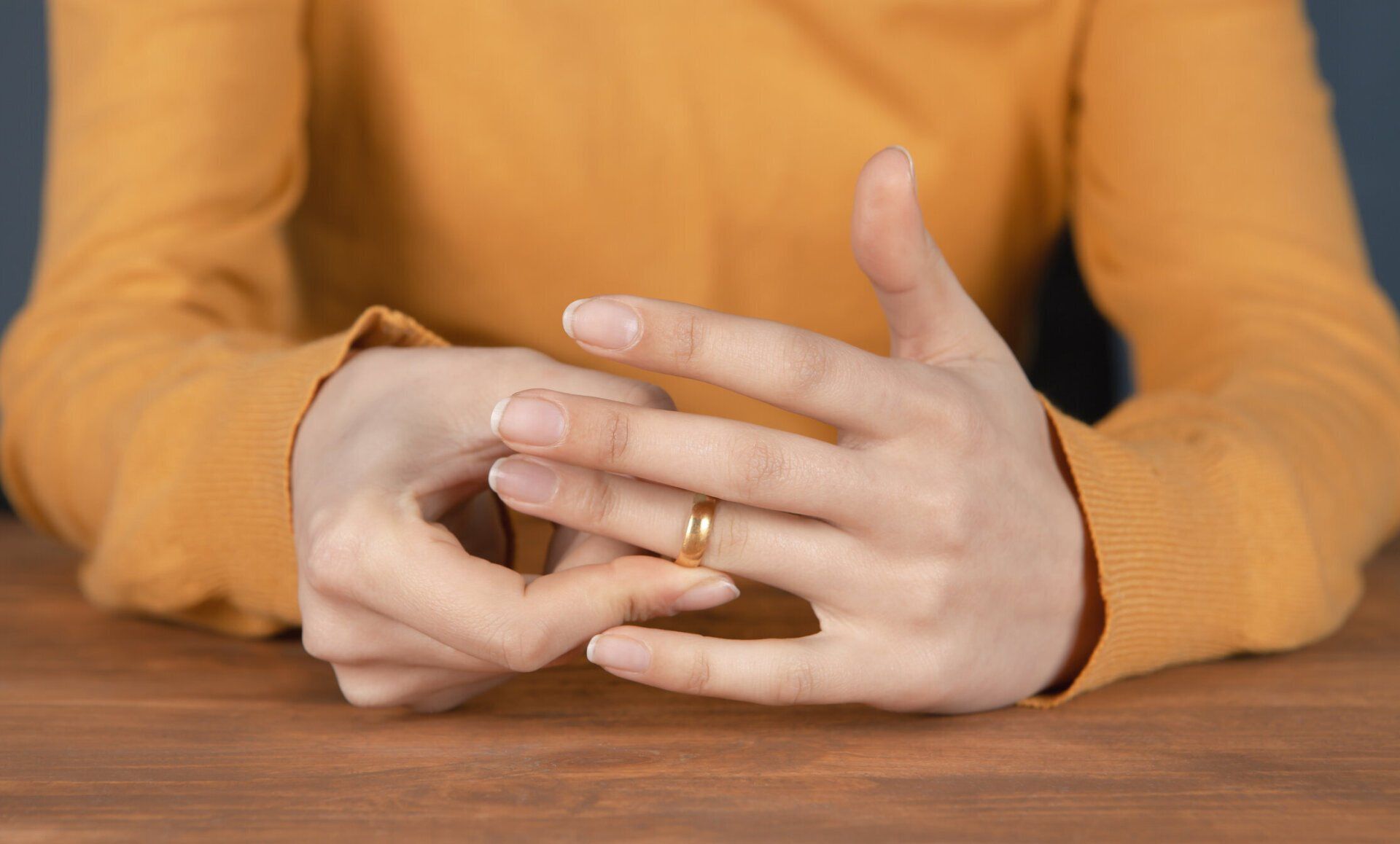 Person Removing Her Wedding Ring - Duncan, OK - The Kanehl Law Firm P.L.L.C.