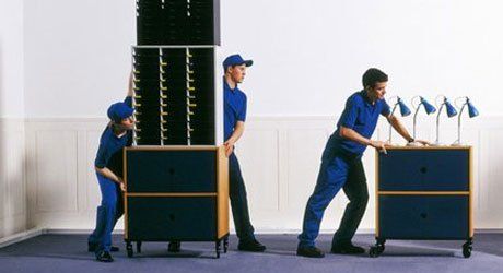 men moving office furniture for removals
