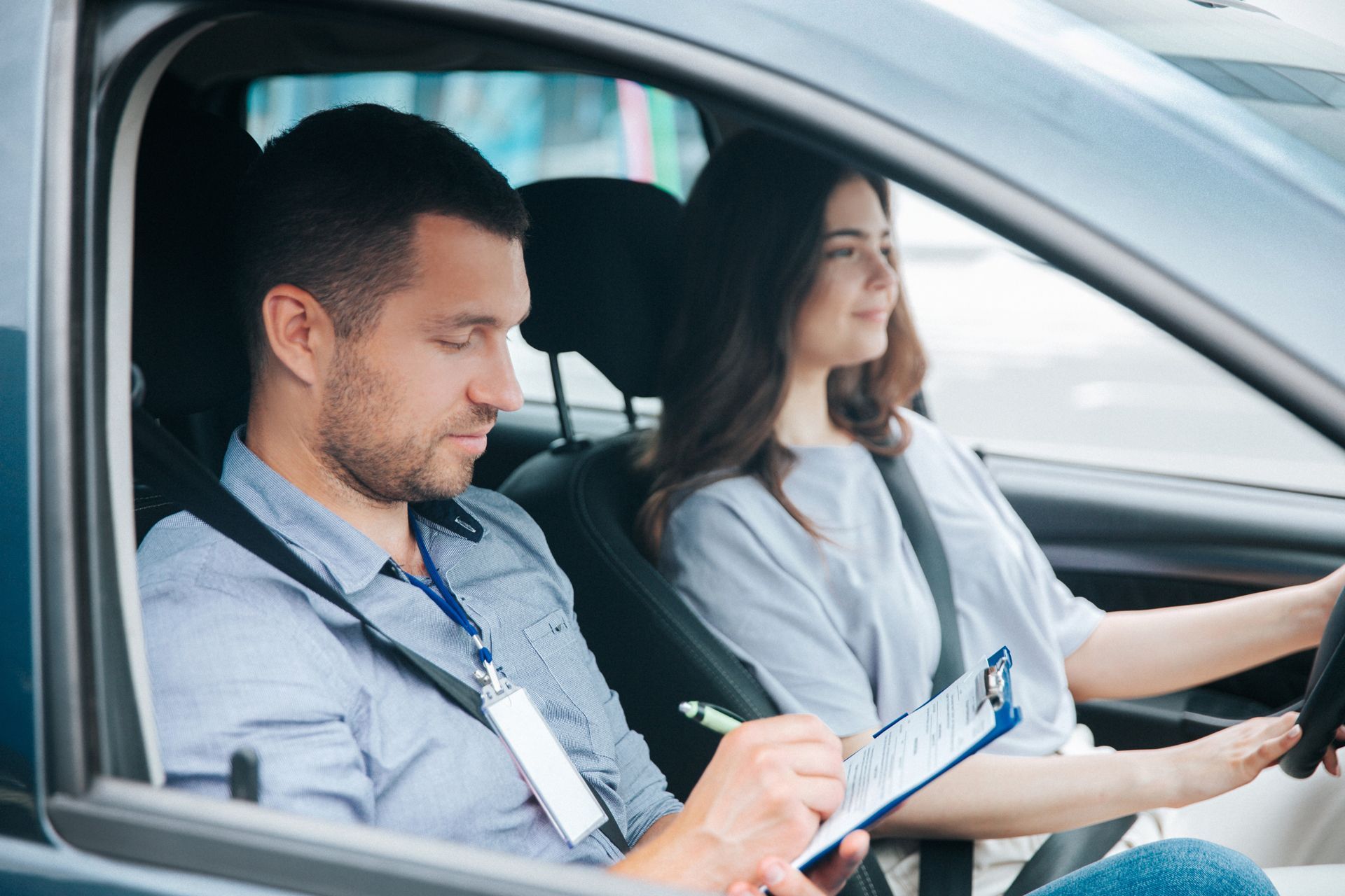 A Man is Teaching a Woman How to Drive a Car