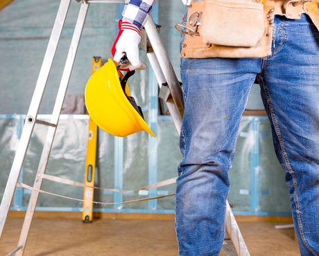 Home Maintenance — Construction Worker Holding Hard Hat in Kirkland, WA