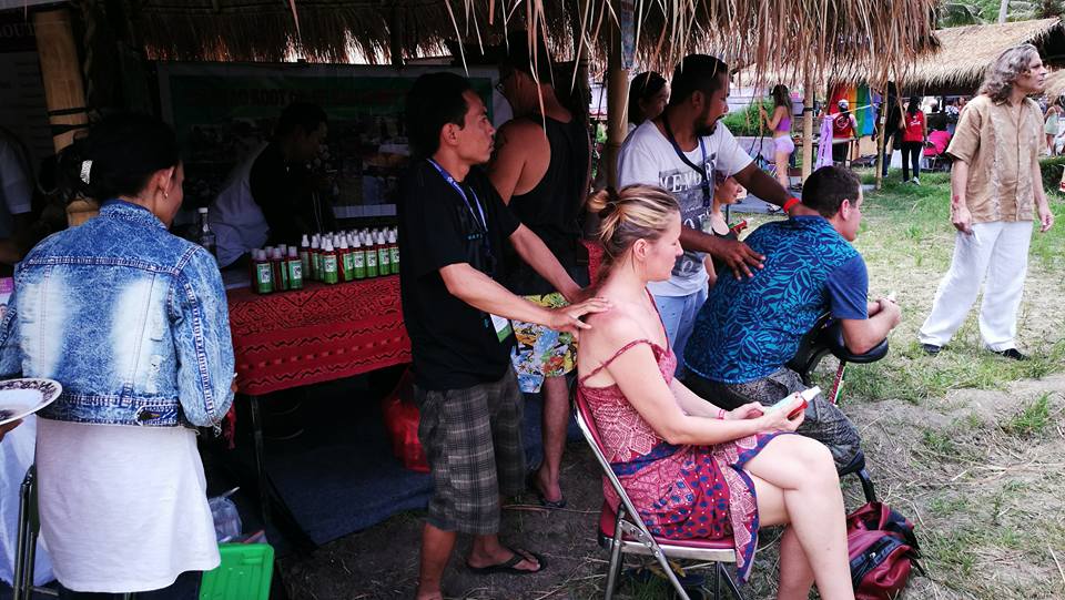 Paramao Oil being applied to clients at Bali festival.