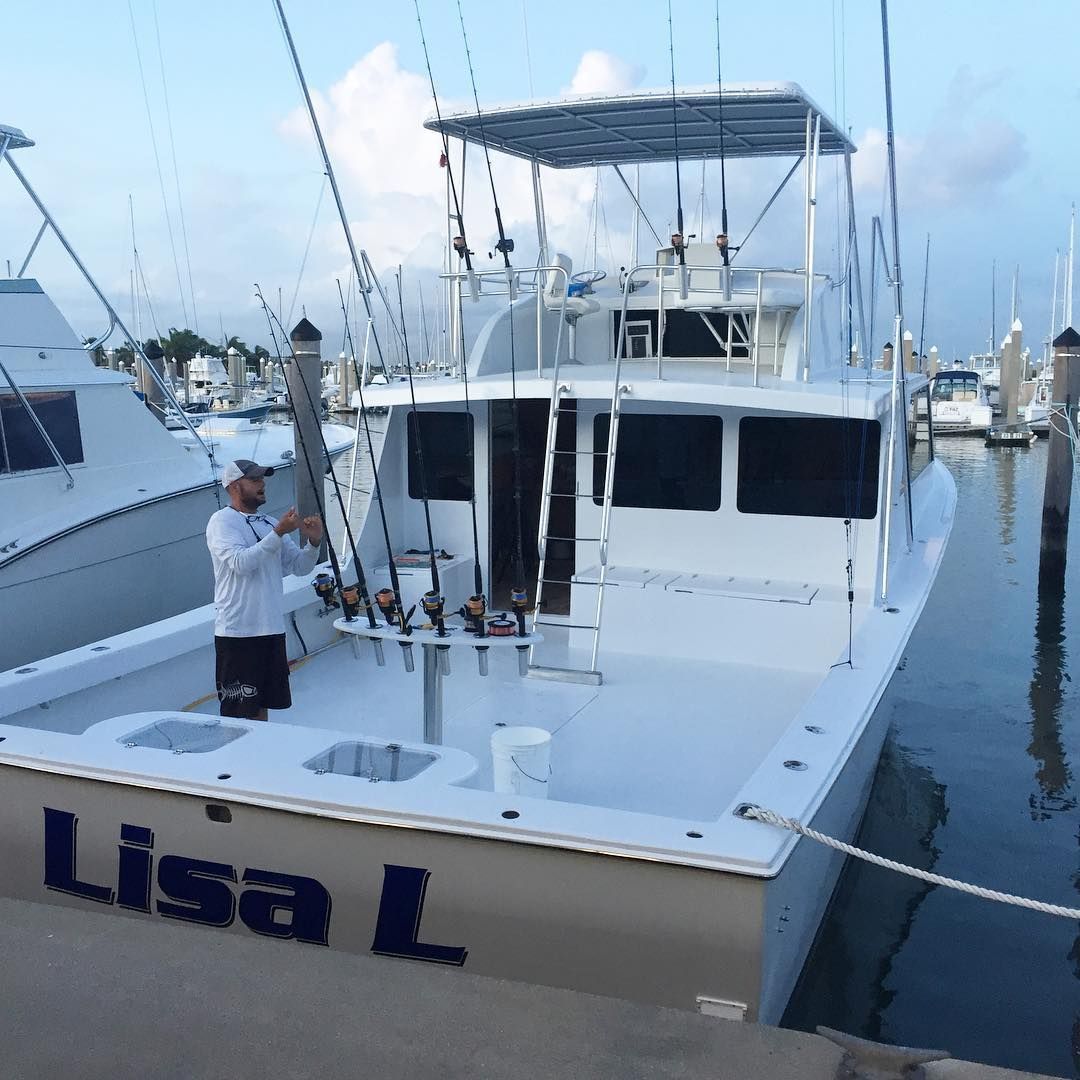 Man on white fishing boat 