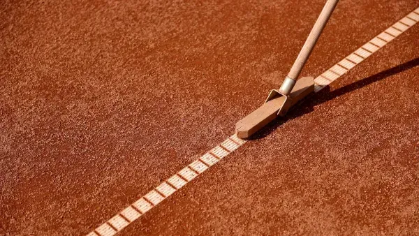 An aerial view of a building under construction with a chimney on the roof.