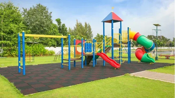 An aerial view of a building under construction with a chimney on the roof.