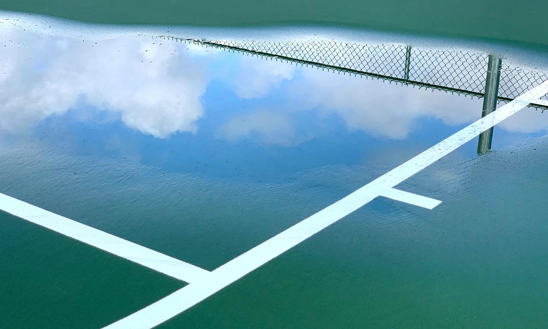 An aerial view of a building under construction with a chimney on the roof.