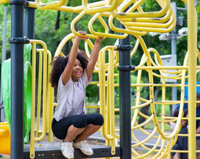 An aerial view of a building under construction with a chimney on the roof.