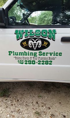 A white truck door featuring the green text 