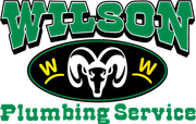 Logo for Wilson Plumbing Service, featuring a white ram head on a black oval, flanked by yellow Ws with green text.