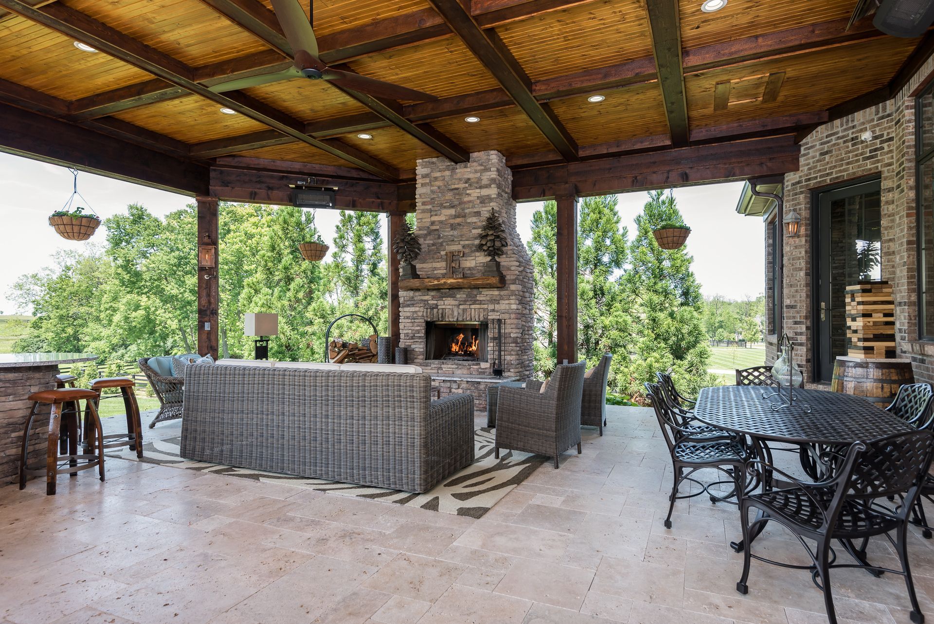 There is a fireplace in the middle of the patio.