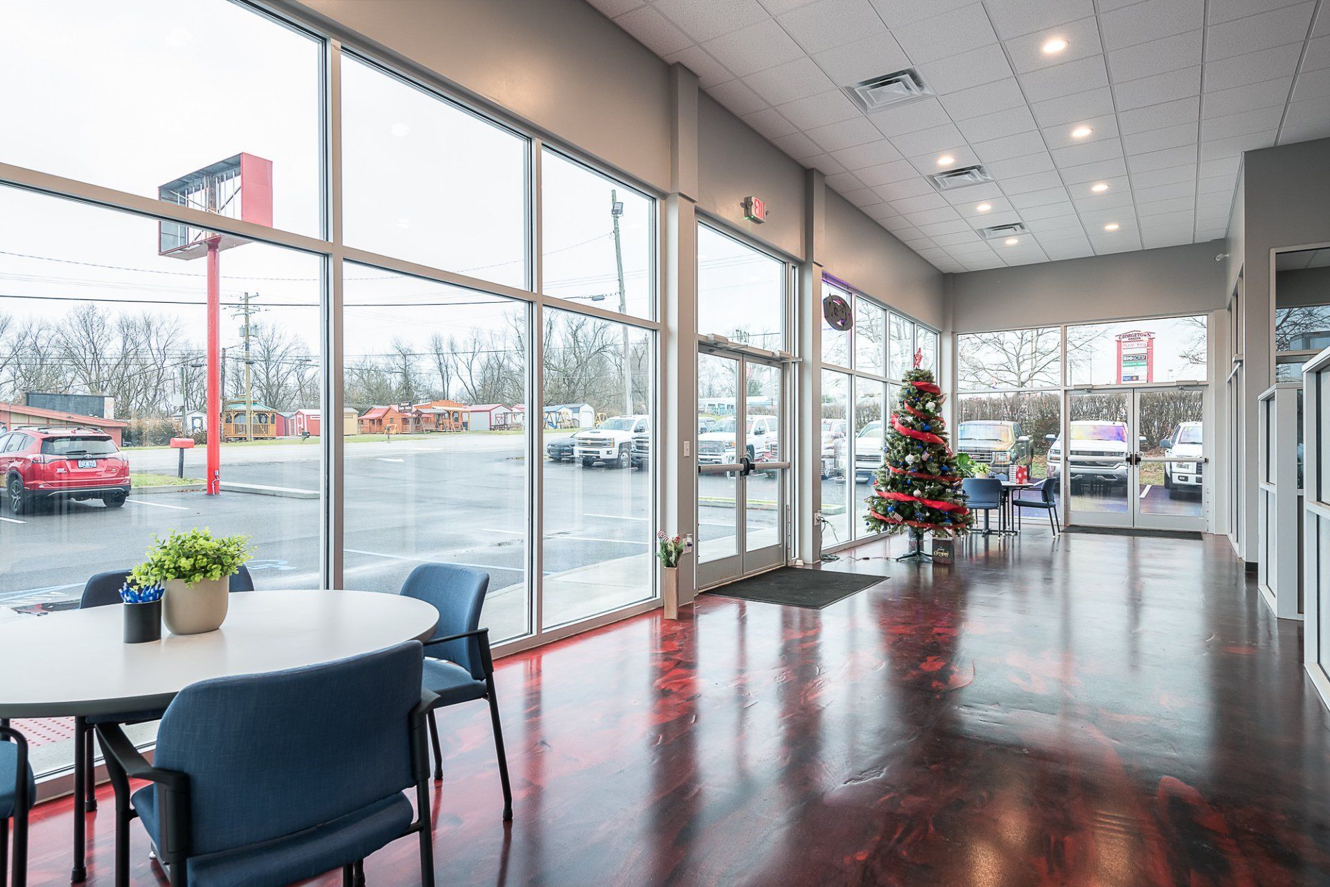 There is a christmas tree in the middle of the room.