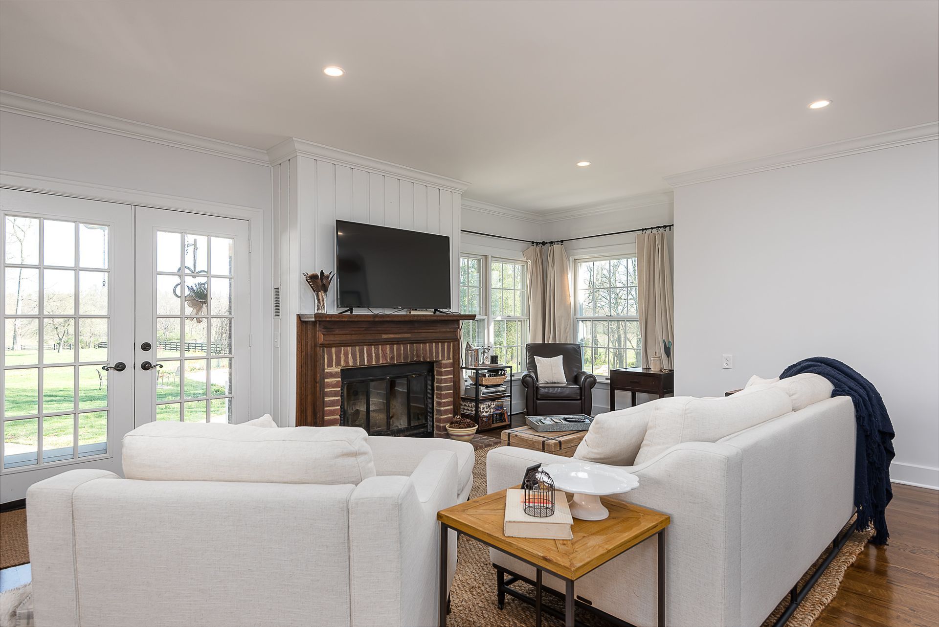A living room filled with furniture and a fireplace.