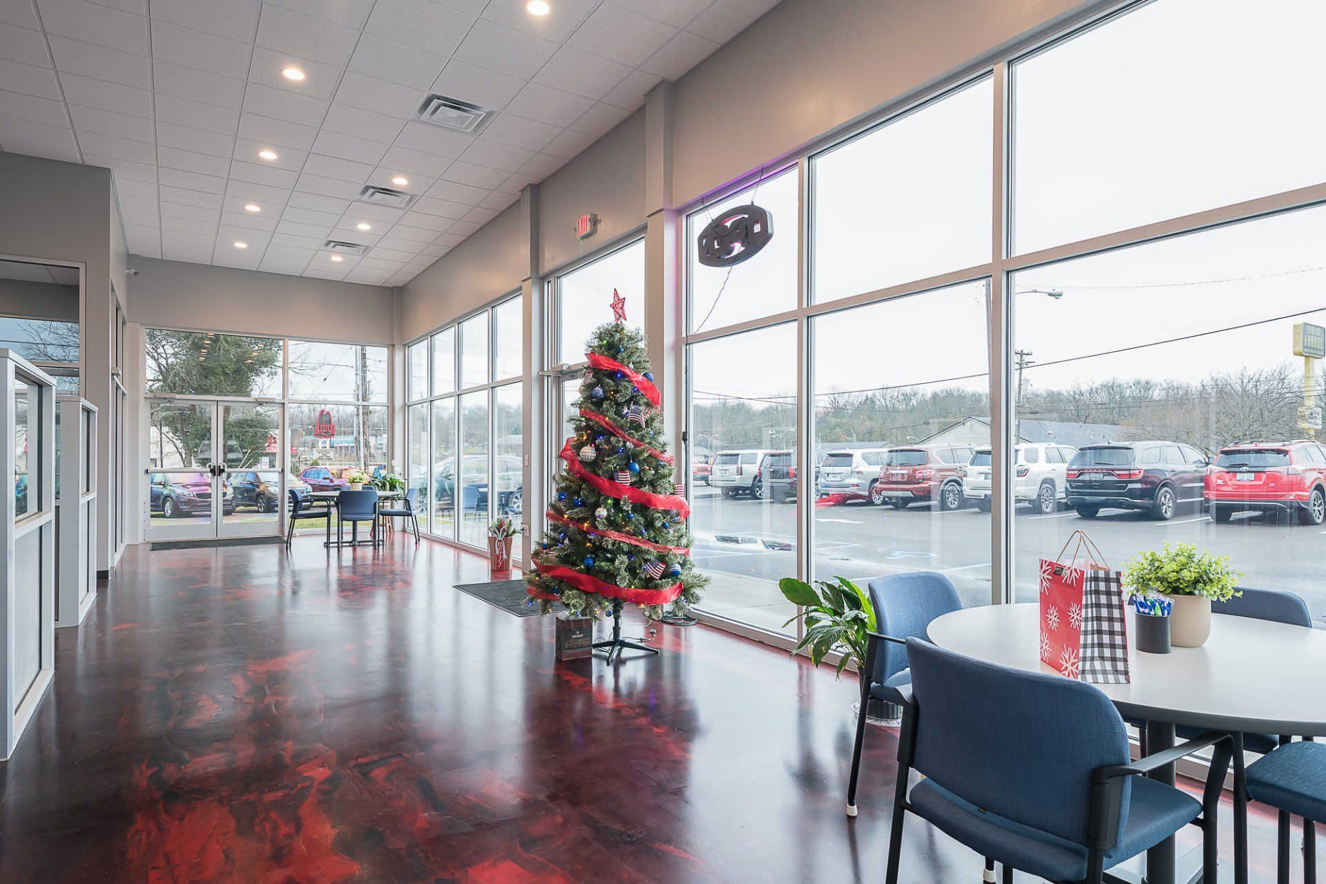There is a christmas tree in the middle of the room.