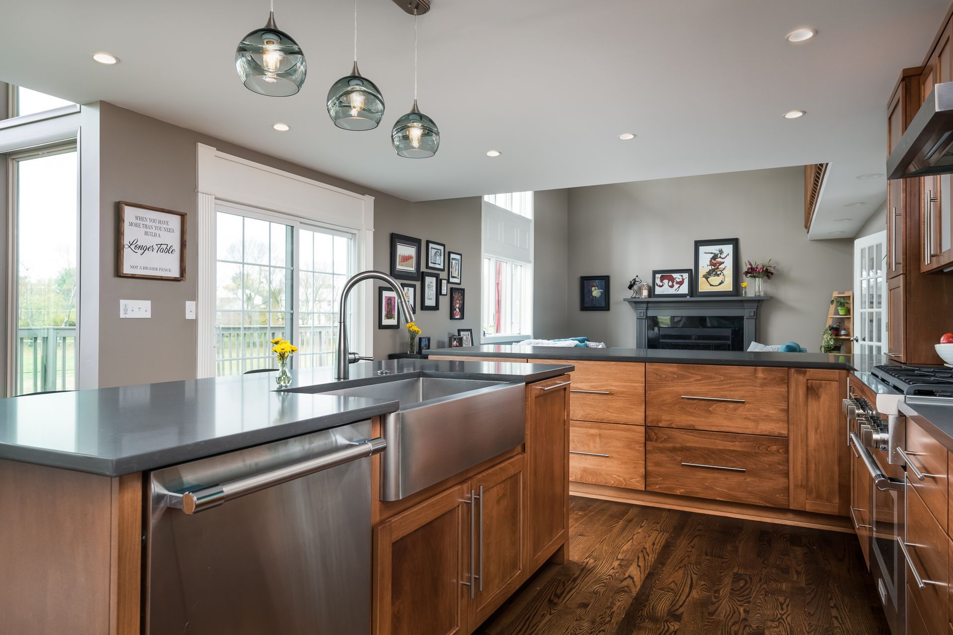 A kitchen with stainless steel appliances and wooden cabinets