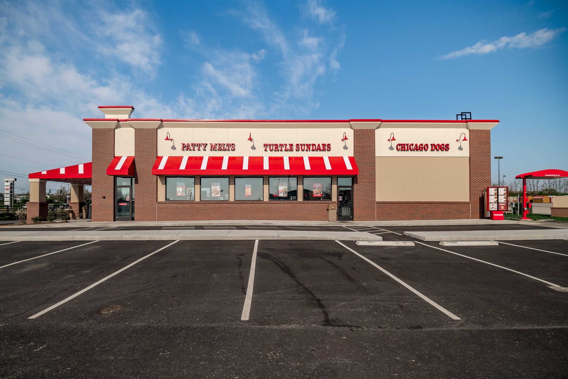An empty parking lot in front of a burger king
