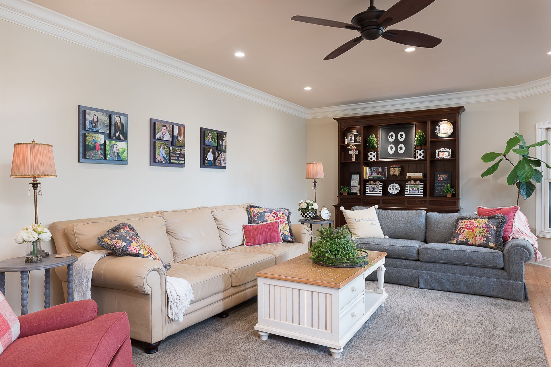 A living room filled with furniture and a ceiling fan.