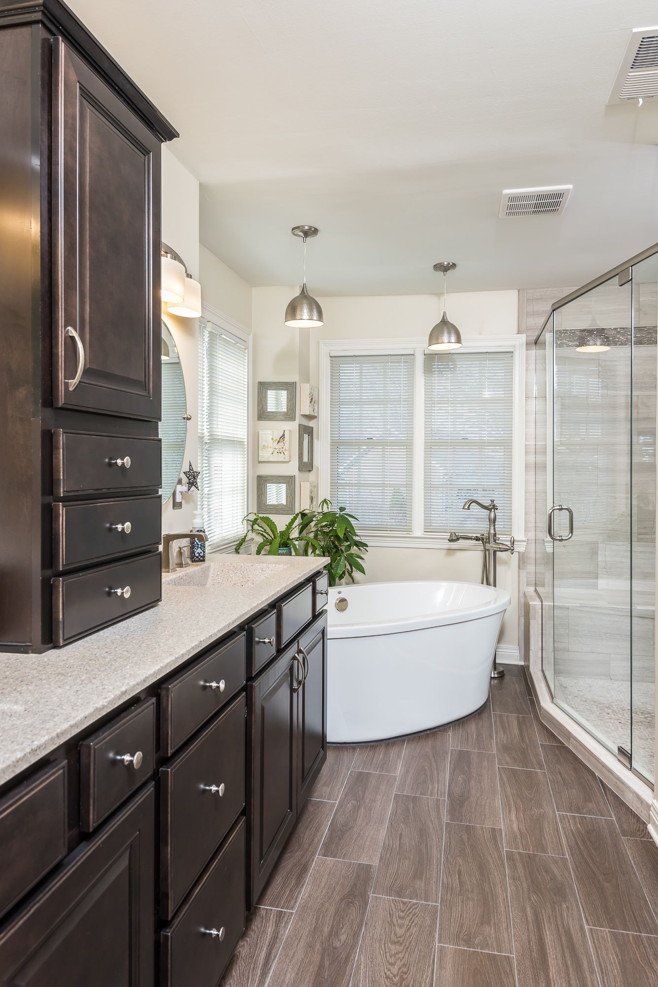 A bathroom with a tub and a walk in shower.
