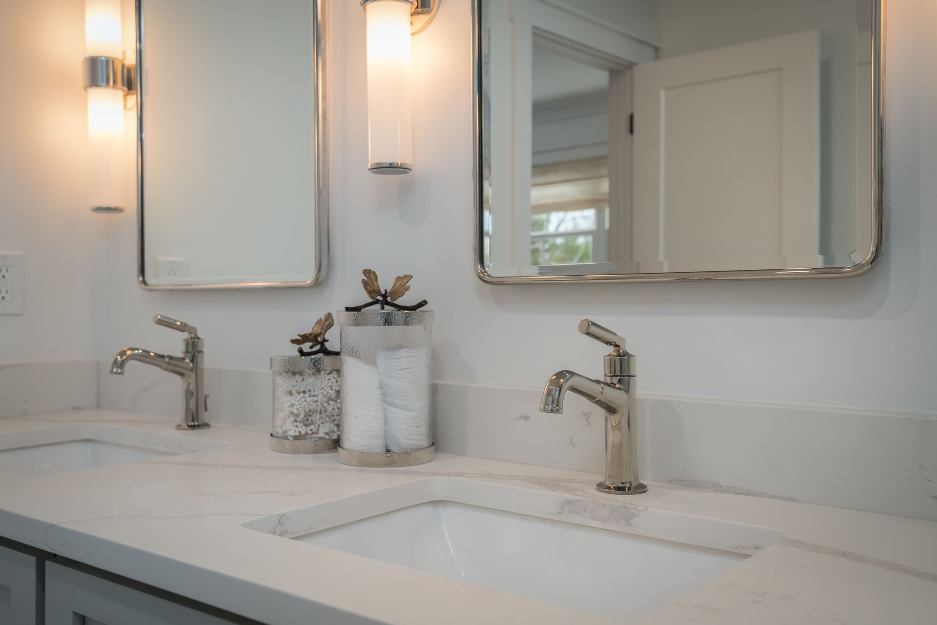 A bathroom with two sinks and two mirrors.