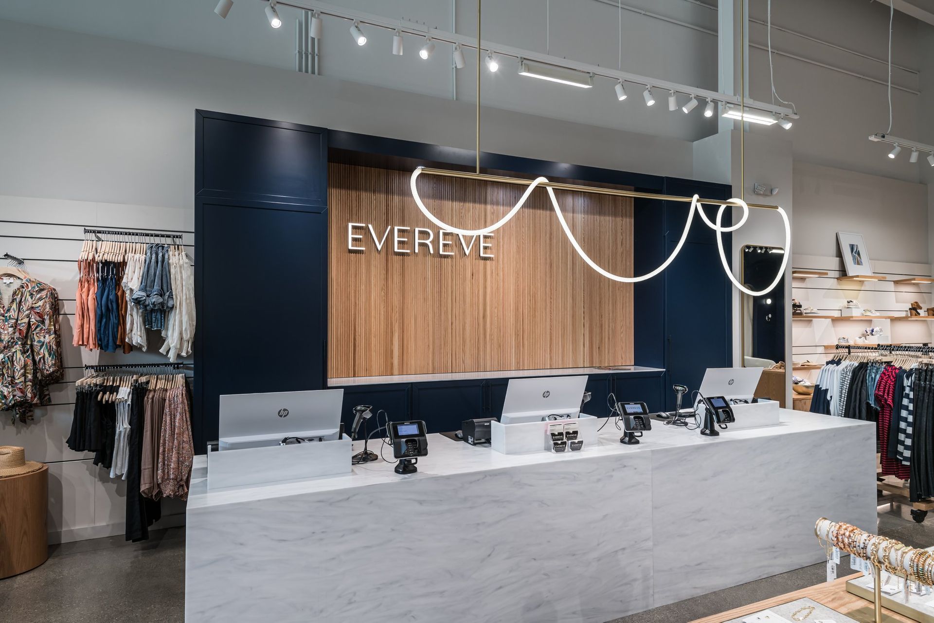 A store front with a wooden sign that says everve on it.