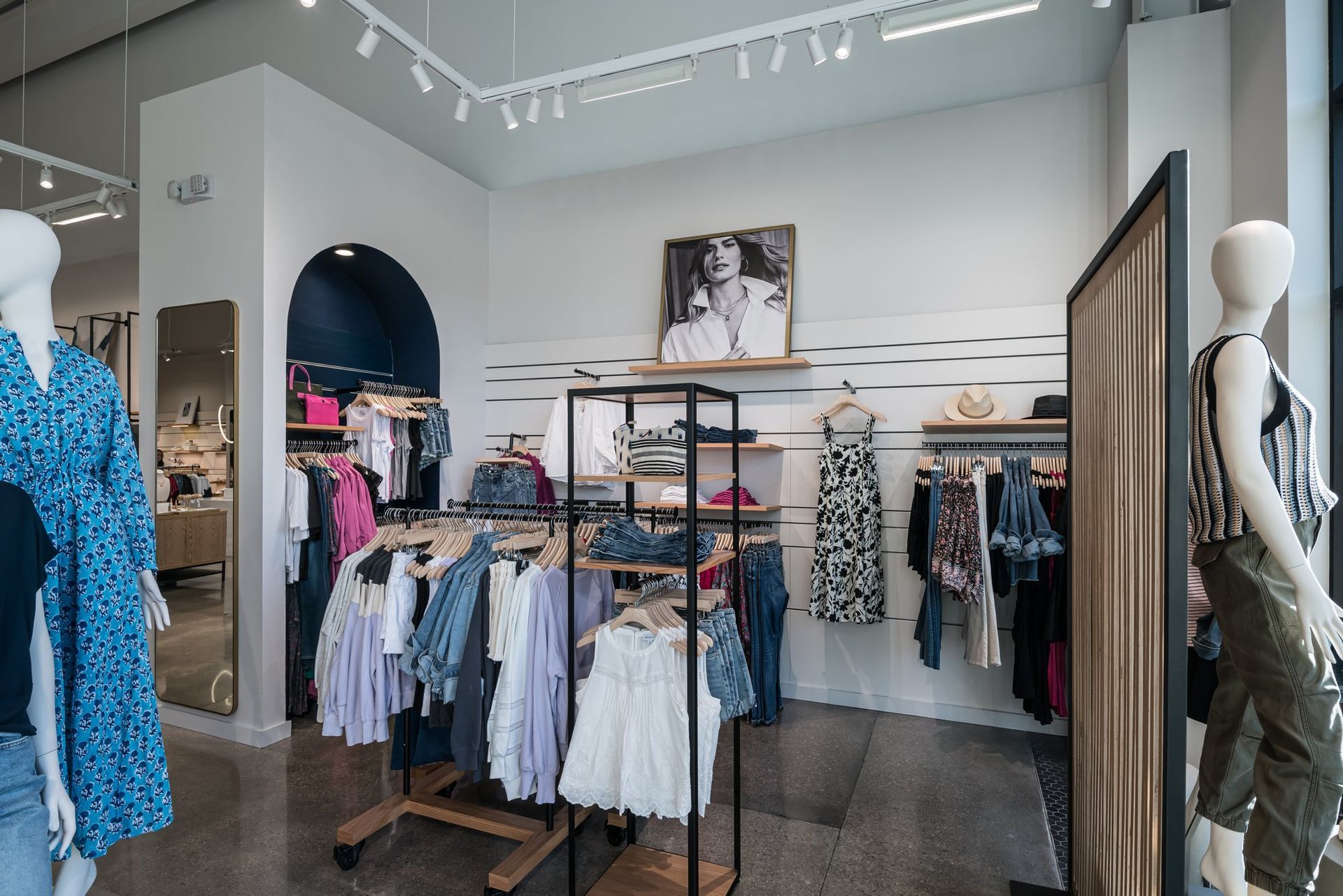 A store filled with clothes and mannequins.