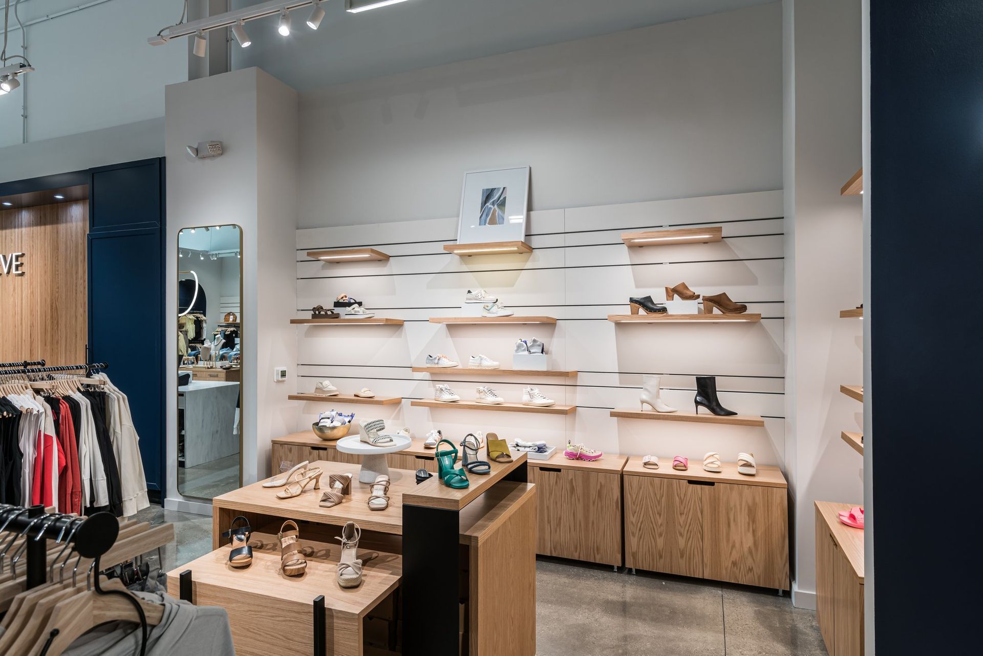 A store filled with lots of shoes and clothes.